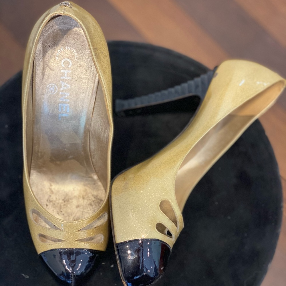Authentic Chanel black and gold pumps